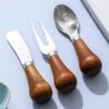 MZCJ-0005   Children's creative tableware with anti-slip wooden handles. Children's spoon, fork and knife set. Can stand upright on a flat surface