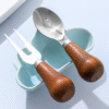 MZCJ-0005   Children's creative tableware with anti-slip wooden handles. Children's spoon, fork and knife set. Can stand upright on a flat surface